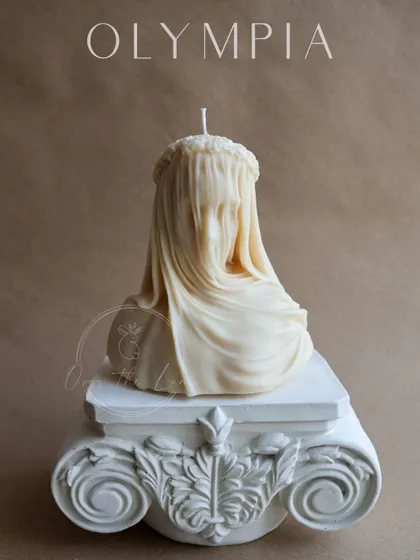The Veiled Lady candle, a true work of art. It's a large, statement piece that is sure to captivate and impress wherever it's displayed.