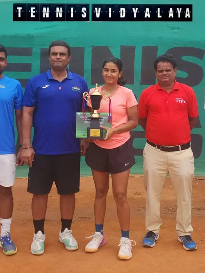 Tamanna and her coaches celebrating her Super Series win.