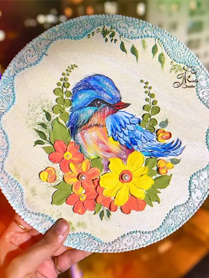 Another view of the charming bird and flower wall plate.