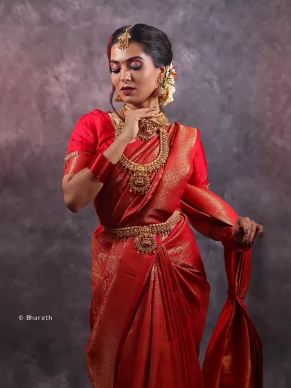 A full-length view of a traditional saree portrait in the studio, showing the complete look from head to toe.