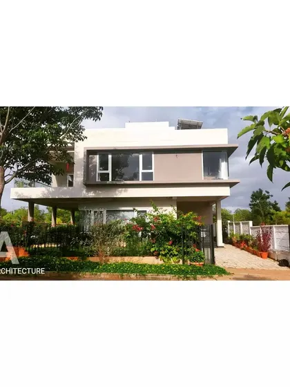 Another perspective of the contemporary villa, showing how the surrounding landscape and garden become an essential part of the home's identity. This sustainable design ensures the home feels connected to its natural environment.