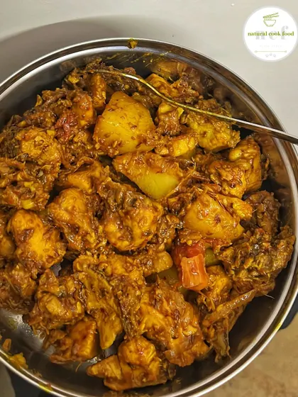 A comforting bowl of chicken and potato curry, the perfect meal for a rainy day.
