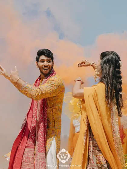 This Haldi ceremony was a burst of color and unforgettable moments. We used vibrant tissue flowers, playful origami birds, and colorful smoke bombs to bring the venue to life.