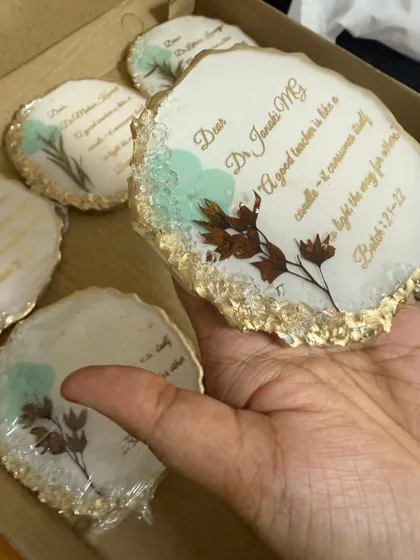 Another view of the custom thank you coasters. The combination of real pressed flowers, a heartfelt message, and the gold geode edge makes for a very special gift.