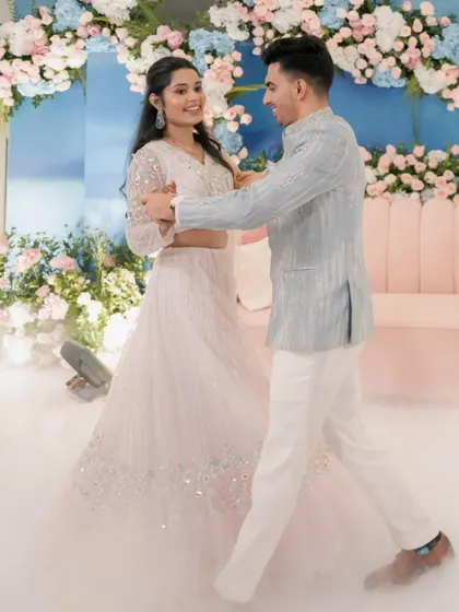 A sweet moment between Yash and Sakshi during their Roka ceremony. We created a romantic atmosphere with soft lighting and a beautiful floral backdrop for their first celebration as a couple.