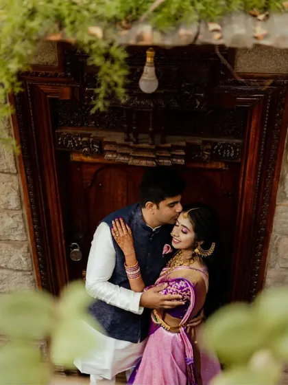 A sweet embrace amidst the marigold decor. We captured this candid moment between the couple on a swing, showcasing their playful connection during their wedding celebrations at The Tamarind Tree.