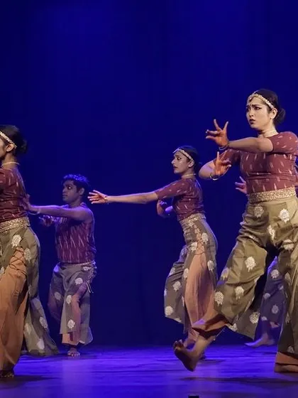 A dynamic group movement from 'Rasadrishta', showcasing the blend of contemporary and classical styles used in the production.