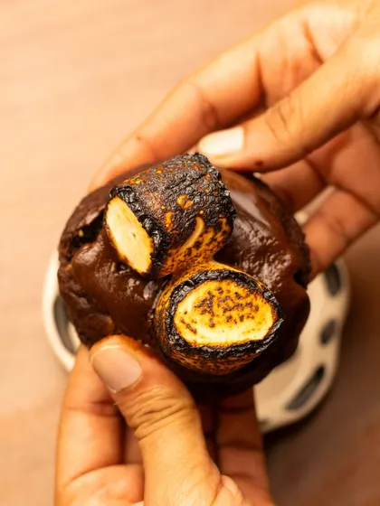 This shot shows the s'mores cookie being picked up, giving a sense of scale and making it feel more interactive and tempting for the viewer.