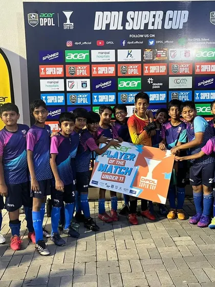The U11 team celebrating their goalkeeper, Aviraj, who was named Player of the Match. A great moment for the whole squad.
