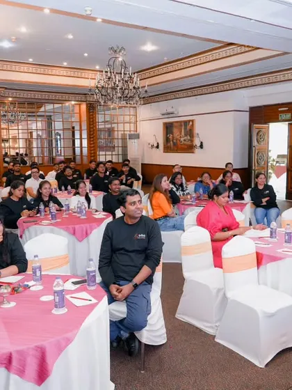 A wide shot of the audience engaged during a corporate conference. This helps to show the scale and success of your event.