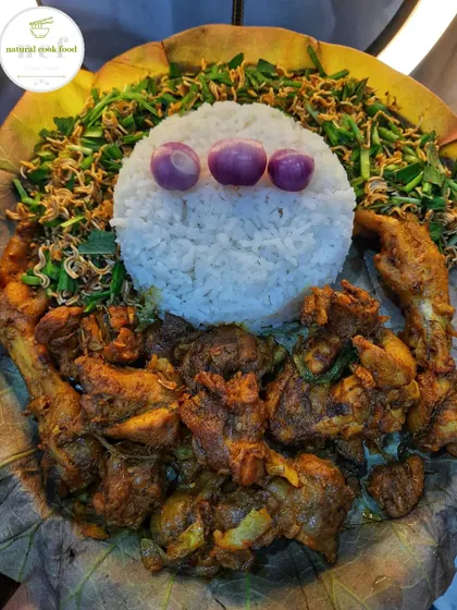 Served on a fragrant lotus leaf, this meal includes country chicken stir fry and a spicy chive and noodle singju.