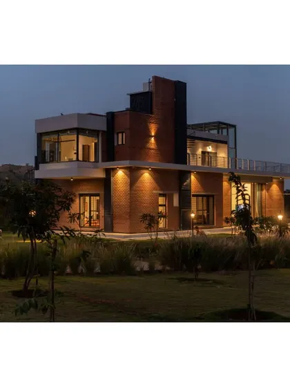 This is a duplicate of ID 81. The Weekend Home at Nandi Hills, illuminated at dusk.