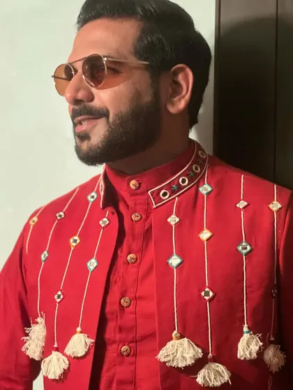 A close-up of my red kurta for Day 4 of Navratri, showing the intricate mirror work and tassel details that define my festive wardrobe.