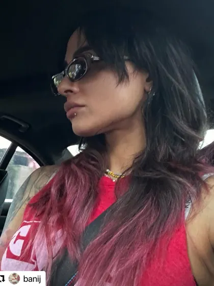 The amazing Bani J showing off the long shag or "wolf cut" I did for her, complete with a faded pink color. This cut is all about texture, layers, and a rock-and-roll attitude.