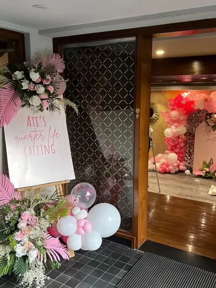 A beautiful welcome sign and entrance decor that sets a sophisticated and fun tone for the milestone birthday party.