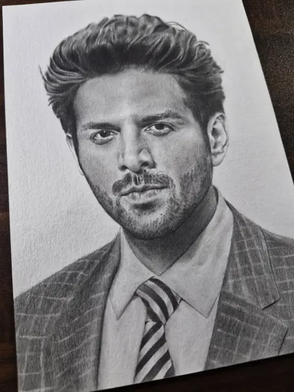 A sharp and stylish portrait of Bollywood actor Kartik Aaryan, perfect for any fan of his work.