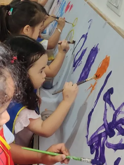 A close-up view of our young artists deeply engaged in their work. I provide the tools and the space, and they bring their unique creativity to the canvas, making their own artistic choices.