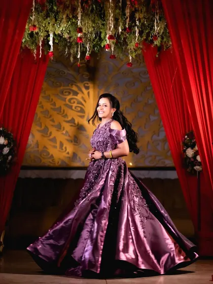 A joyful portrait of the bride-to-be, her happiness shining through as she poses in her engagement attire.