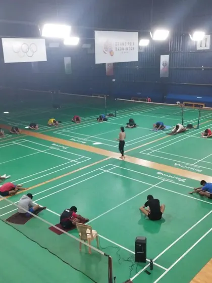 A group of our badminton players fully engaged in a mindful movement and breath session. This practice helps them connect their mind and body, leading to improved focus and on-court decision making.