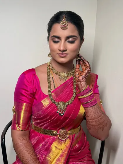 A close-up of Janaki's eye makeup. The soft, neutral shimmers and defined liner create a sophisticated and elegant look.