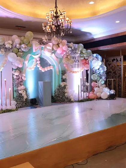 A wider view of the stage, showing the scale and beauty of the decor in the venue.