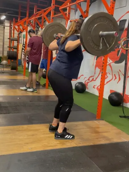 This athlete is in the receiving position of a drop snatch. This drill is purely about speed and forces the athlete to get under the bar aggressively, improving turnover time.