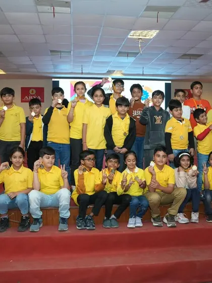 A full stage of participants from one of our centers, all proudly showing their medals.