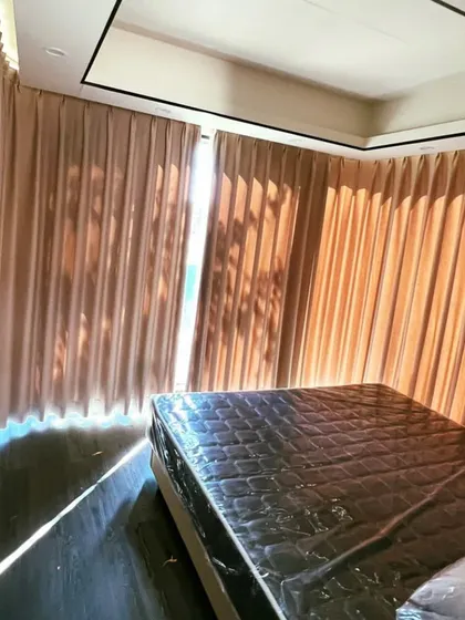 Another view of the bedroom in the Space Capsule, showing how the curtains provide privacy while still allowing for natural light to filter through.