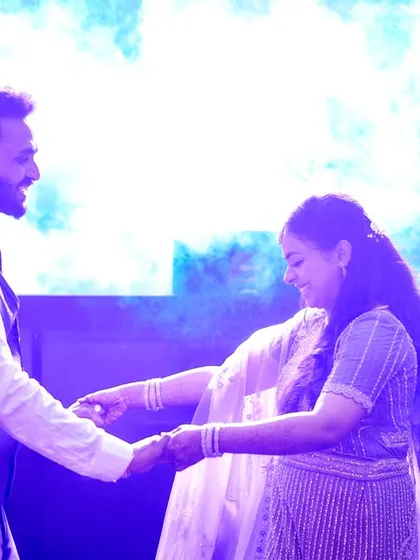 Another moment from the dance floor, capturing the couple's happy and relaxed interaction.