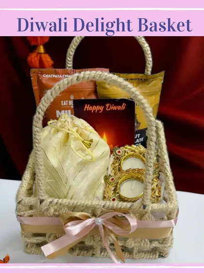 The 'Diwali Delight' basket offers a rustic charm with its jute-woven design. It's filled with snacks, a silk potli, and a beautiful golden diya holder.