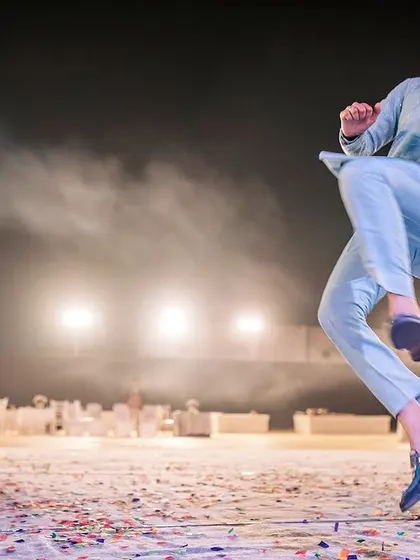 The energy of a Sangeet performance is unmatched. I used a fast shutter speed to freeze this groom mid-air, capturing the absolute joy and exuberance of his dance.