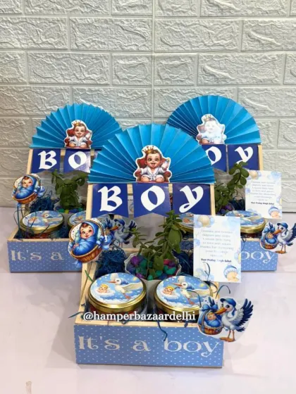 It's a boy! Our boy announcement hampers are a wonderful way to share your happy news. This one includes a pinewood basket, flavored foxnuts, chocolate cookies, a small planter, and a custom thank you card.