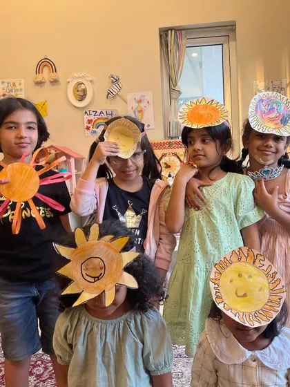 More sunny faces from our sun-themed art class. It's pure joy to see them this happy with what they've made.