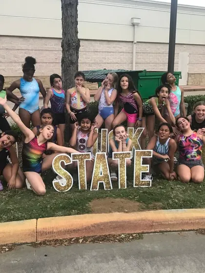 A big, fun group photo to wish our Bronze and Silver teams good luck at State