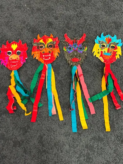 A whole family of colourful dragon masks ready for the Lunar New Year parade!