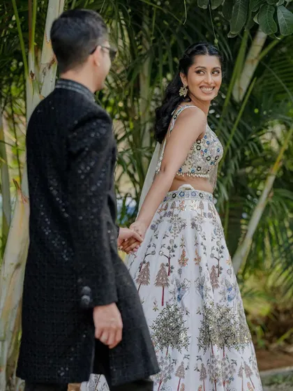 The perfect setting for a pre-wedding cocktail party or sangeet night. The lawn provides ample space for a dance floor, while the surrounding trees, lit with elegant chandeliers and string lights, create a festive and celebratory atmosphere.