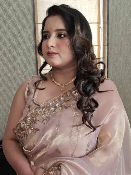 Another angle of this pretty party makeup. The soft curls in her hair complete the elegant look.