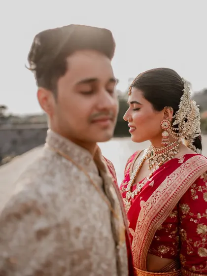 An artistic portrait using shallow depth of field to draw focus to the bride's serene expression. This technique allows us to create fine art wedding photos that are both beautiful and emotive.