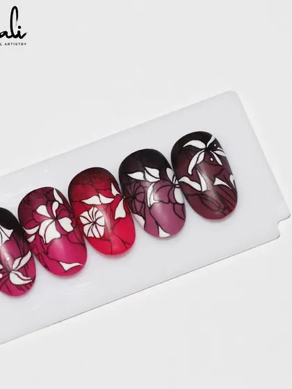 The full set of the floral stamping art on a red ombre base. The effect is so intricate and beautiful.