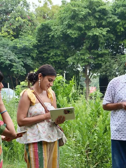 Participants taking notes during the Wild Food Walk. The event is highly educational, and guests are encouraged to document their learnings.