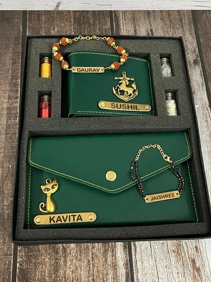 This Bhai-Bhabhi Rakhi set is in a beautiful green, featuring an anchor charm for him and a cat charm for her.