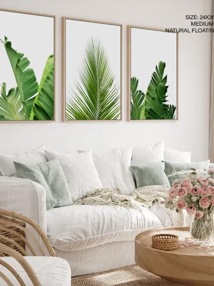 A beautiful display of our three-piece botanical set with natural floating frames. This framing style adds depth and a modern touch, making the vibrant green leaves appear to float on the wall.