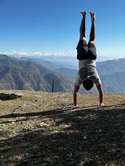 A handstand with the Himalayas as my backdrop. A pro tip: do lots of squats so your glutes look good in your handstand photos.