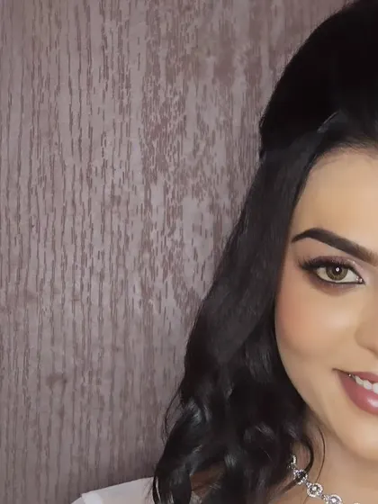 A half-face shot of a model, showcasing the beautiful eye makeup and hairstyle for a Christian wedding look.