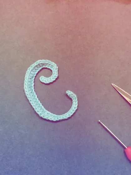 C is for 'Crochet'. This light blue letter 'C' has a beautiful swirl, perfect for personalizing any item.