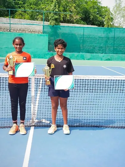 A final shot of the doubles finalists on the court, marking a successful tournament run.