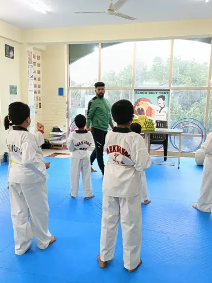 I lead a class of our youngest students from the back of the dojang.