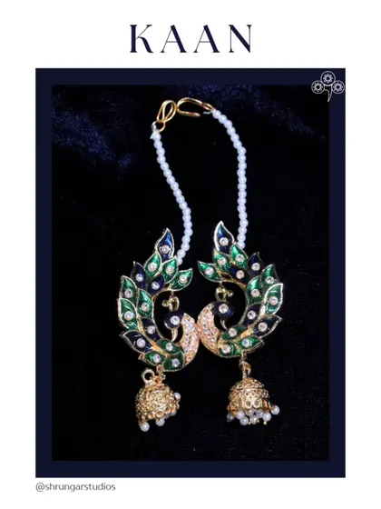 A beautiful peacock design full earcuff with Meenakari work and a delicate pearl chain.