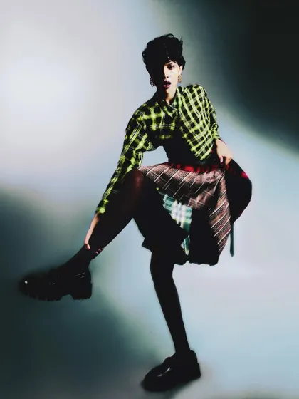 A dynamic, blurred shot from 'My Flatmate's Wardrobe,' capturing the model in mid-motion. The blur conveys the energy and eclectic spirit of the styling.
