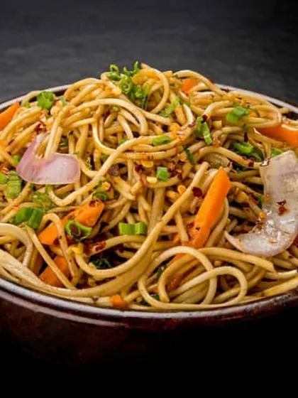 A glimpse of our popular Indo-Chinese menu. This is our signature Veg Hakka Noodles, stir-fried with crisp vegetables and our special sauce blend, perfect for wedding receptions and parties.